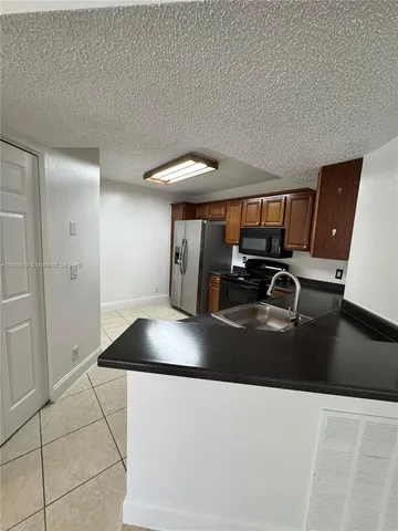 a view of a living room and dining room