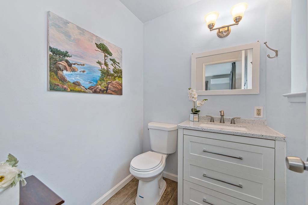 6689 Rhodes Avenue Placerville, CA 95667 - Photo 33 of 60 a bathroom with a toilet a sink and mirror
