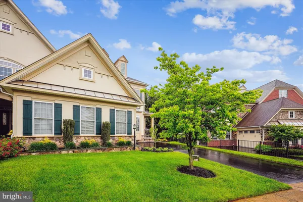 a front view of a house with outdoor seating