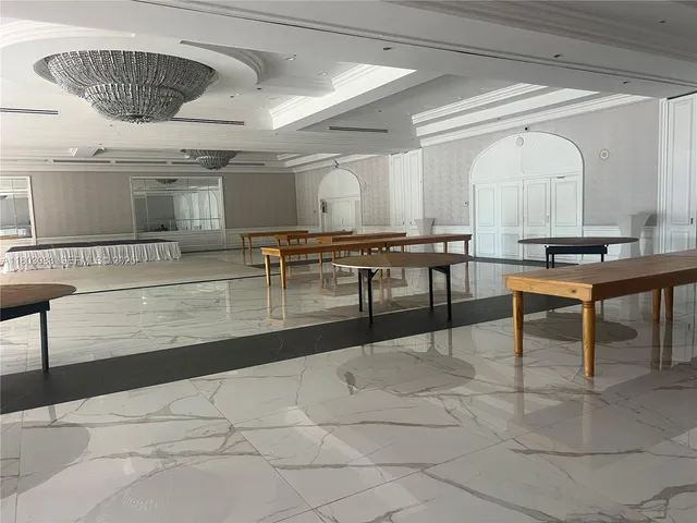 a lobby with furniture and window