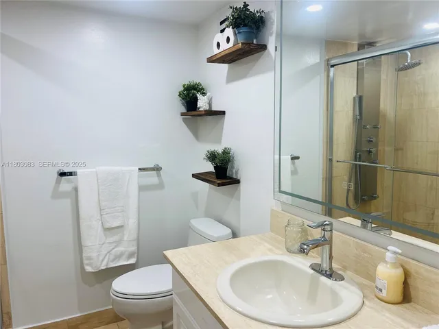 a bathroom with a sink and toilet