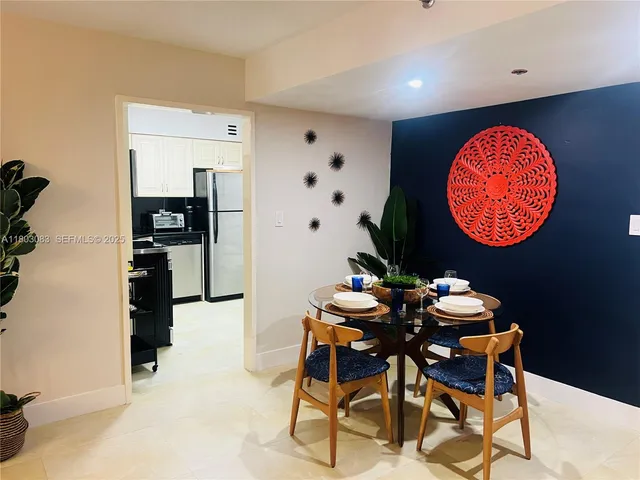 a white refrigerator freezer sitting in a kitchen