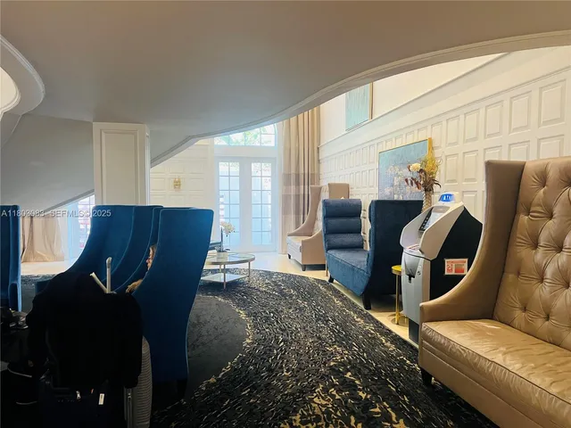 a living room with furniture and stairs