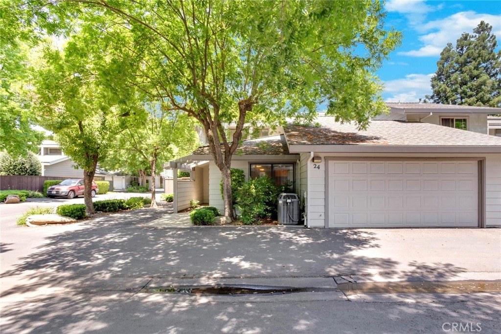 3350 M Street, Unit 24 Merced, CA 95348 - Photo 3 of 38 a front view of a house with a yard and garage