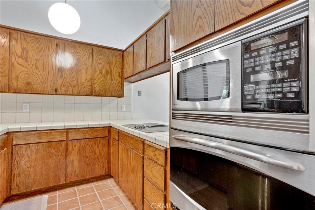 3350 M Street, Unit 24 Merced, CA 95348 - Photo 5 of 38 a kitchen with a sink and a microwave