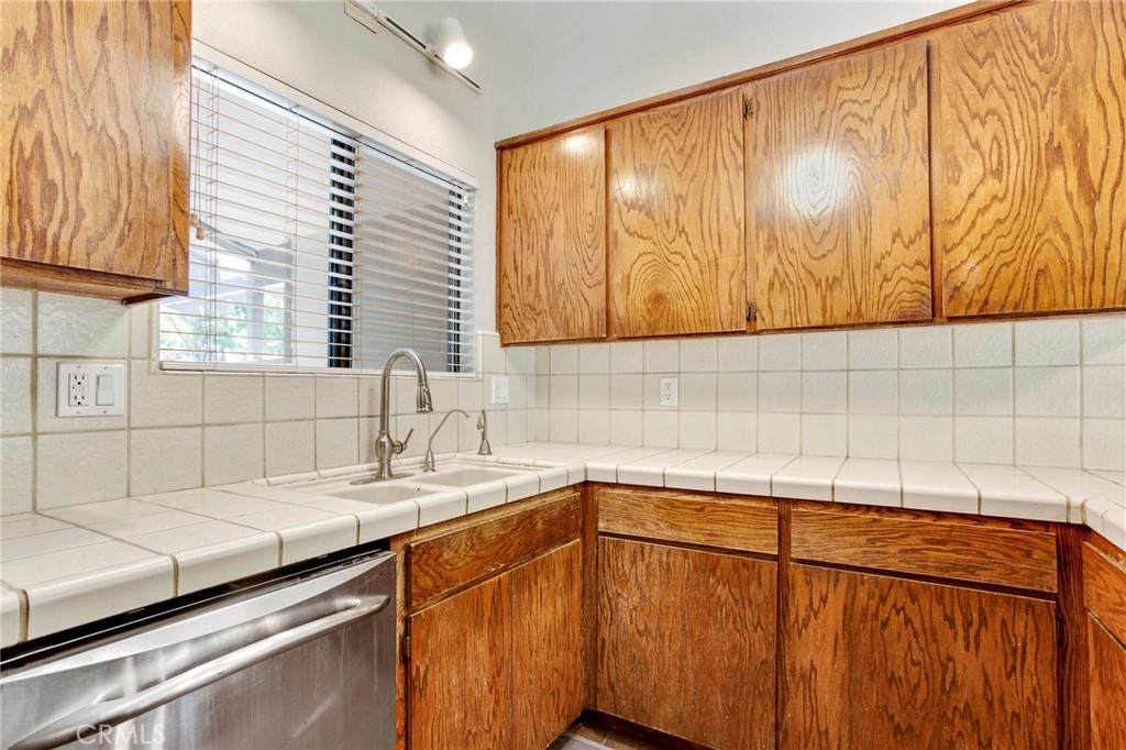 3350 M Street, Unit 24 Merced, CA 95348 - Photo 7 of 38 a kitchen with a sink and cabinets