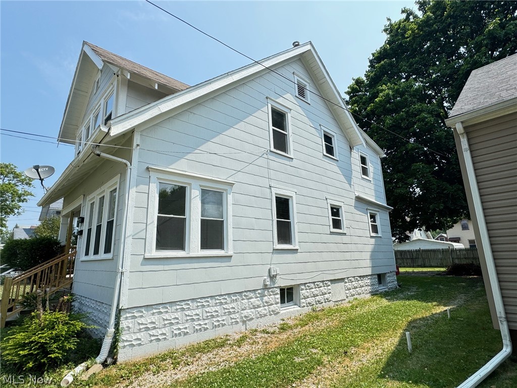 459 Patterson Avenue Akron, OH 44310 - Photo 2 of 24 View of side of home featuring a lawn