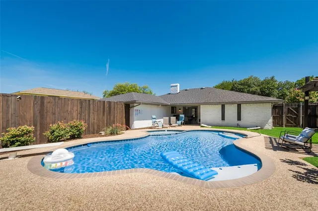 a view of swimming pool with lounge chair