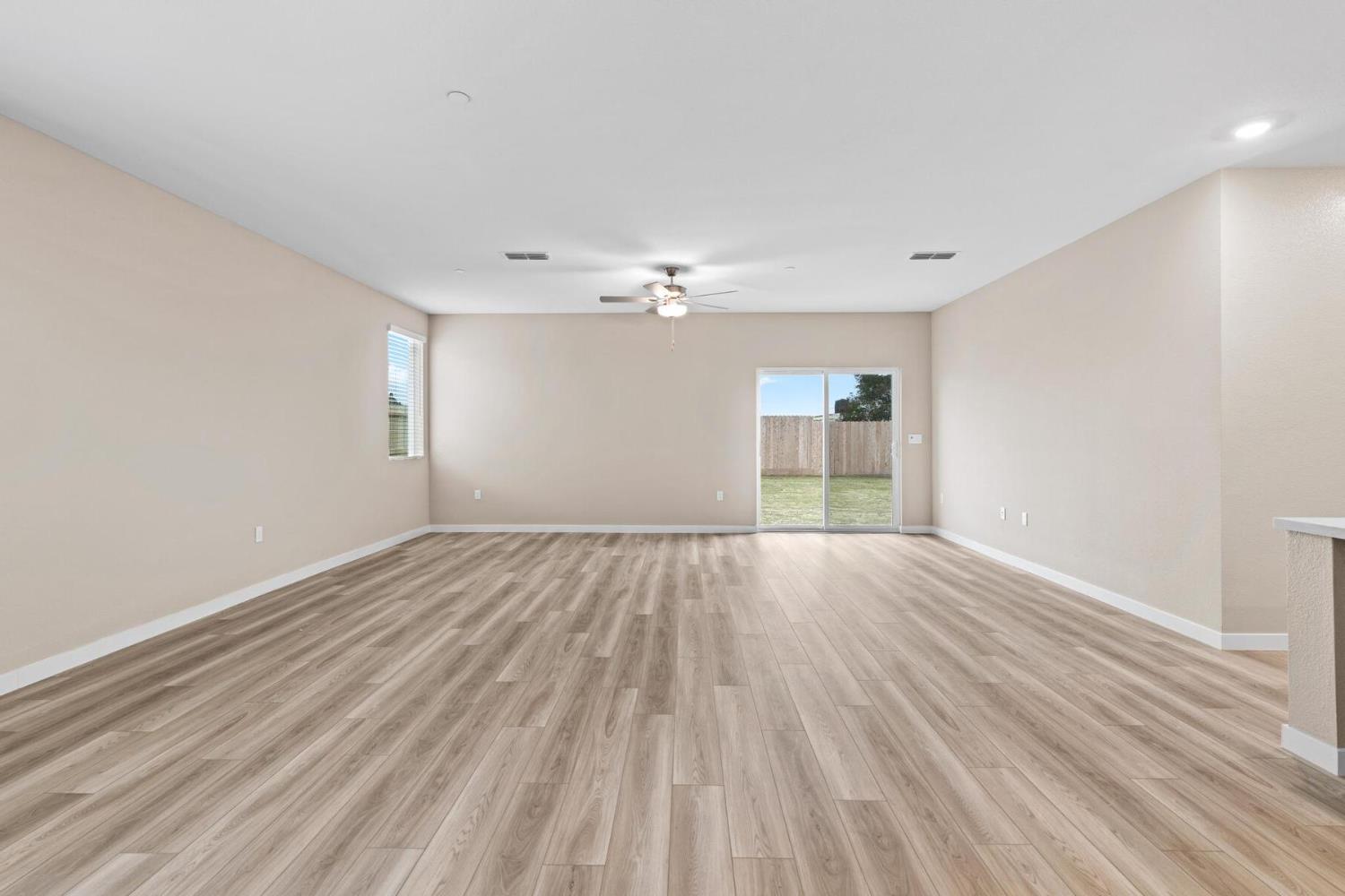 3440 Jake Way Denair, CA 95316 - Photo 6 of 18 a view of an empty room with wooden floor