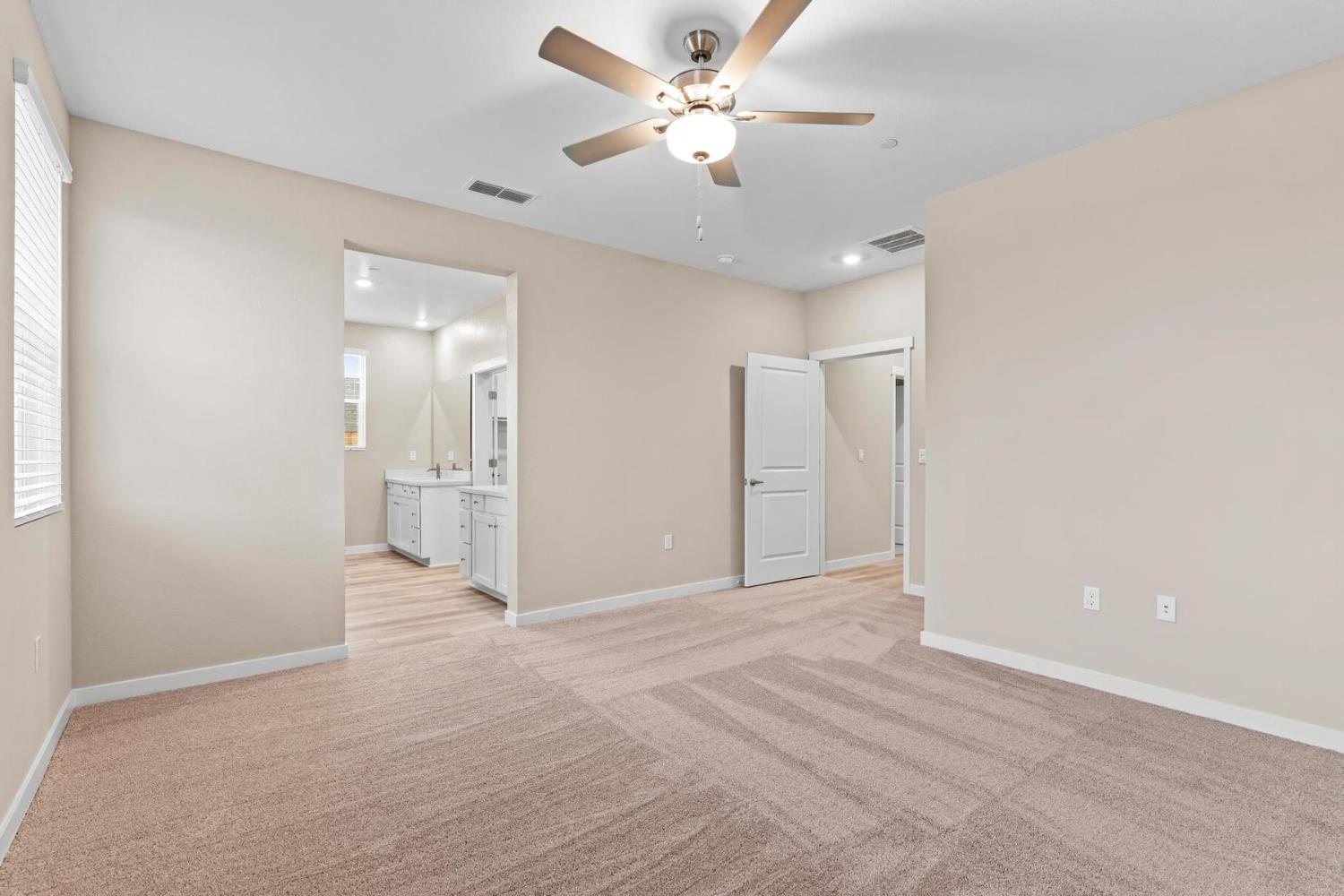 3440 Jake Way Denair, CA 95316 - Photo 9 of 18 a view of a big room with a ceiling fan and a bathroom