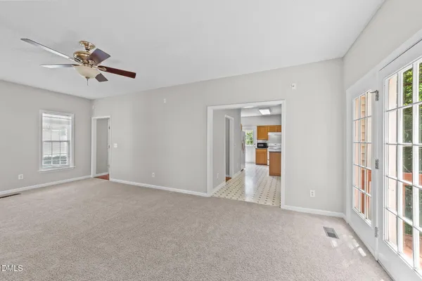 a view of an empty room with a window