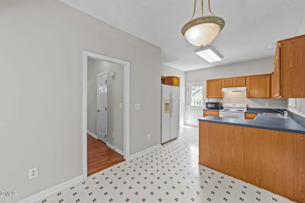 a large kitchen with a window