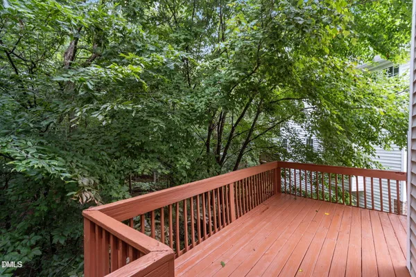 a view of deck with two trees