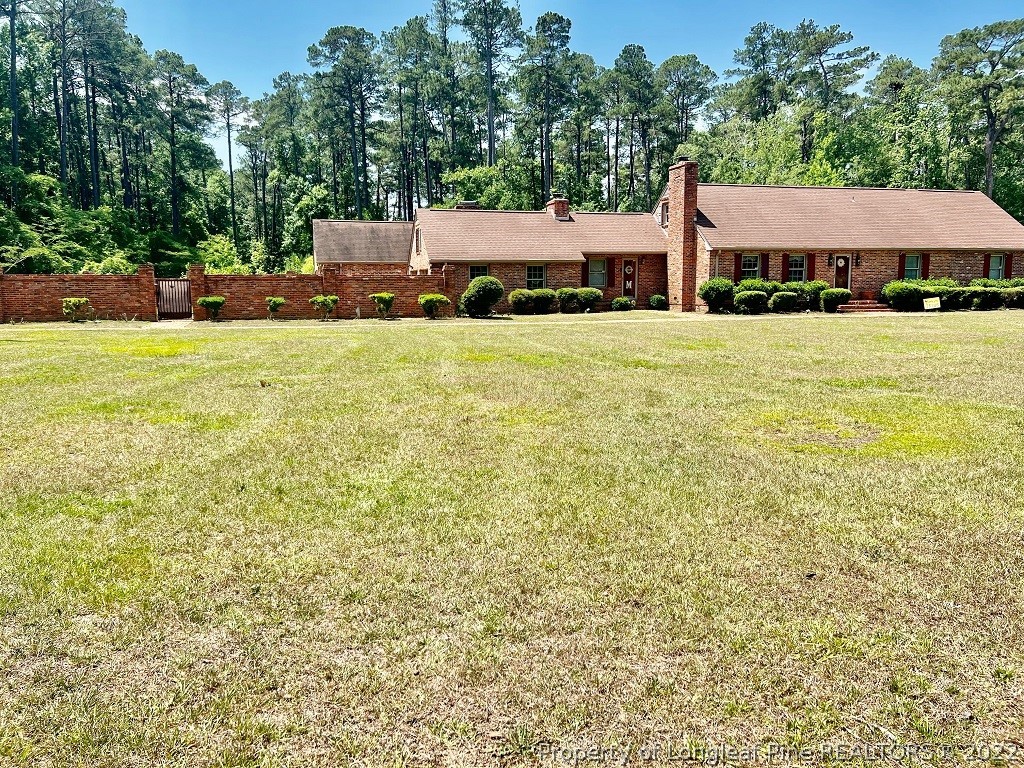 110 Bee Gee Road Lumberton, NC 28358 - Photo 1 of 42 a front view of a house with a yard