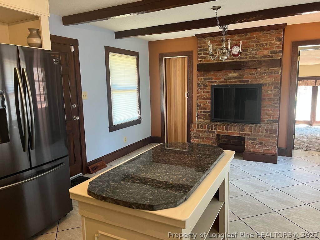110 Bee Gee Road Lumberton, NC 28358 - Photo 16 of 42 a kitchen with stainless steel appliances granite countertop a refrigerator and a stove top oven