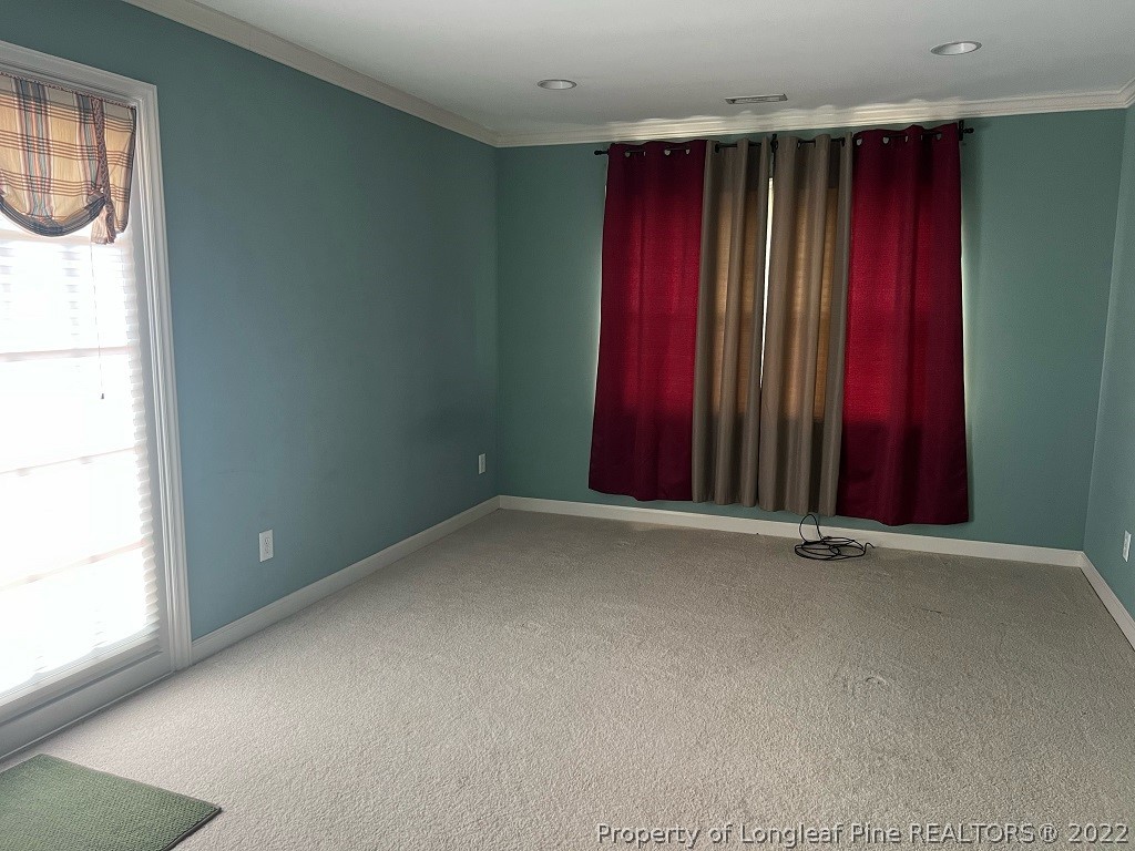110 Bee Gee Road Lumberton, NC 28358 - Photo 20 of 42 a view of a room with red walls and a window