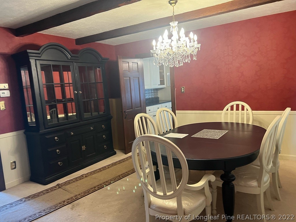 110 Bee Gee Road Lumberton, NC 28358 - Photo 22 of 42 a view of a dining room with furniture and chandelier