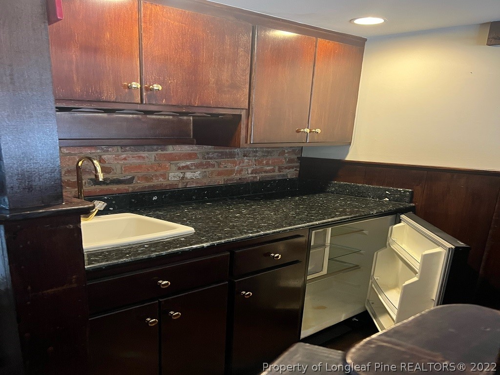 110 Bee Gee Road Lumberton, NC 28358 - Photo 23 of 42 a kitchen with a sink and a stove
