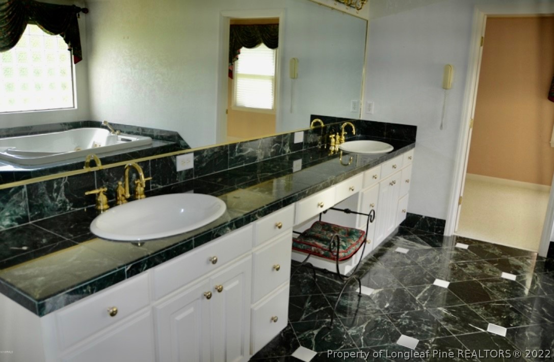 110 Bee Gee Road Lumberton, NC 28358 - Photo 26 of 42 a kitchen with a sink and a stove