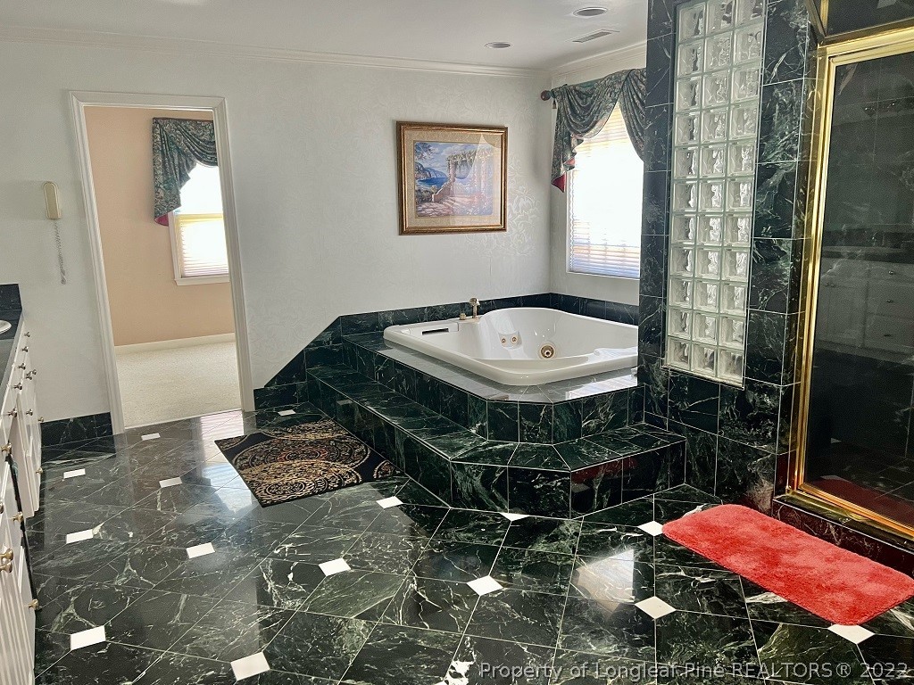 110 Bee Gee Road Lumberton, NC 28358 - Photo 27 of 42 a bathroom with a sink and a mirror