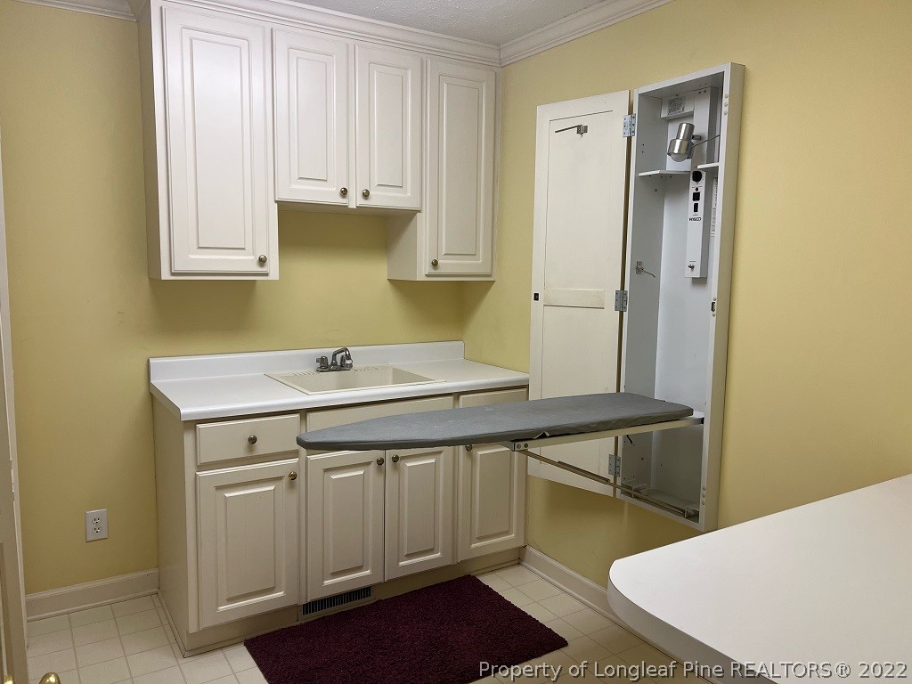 110 Bee Gee Road Lumberton, NC 28358 - Photo 29 of 42 a bathroom with a sink and a mirror