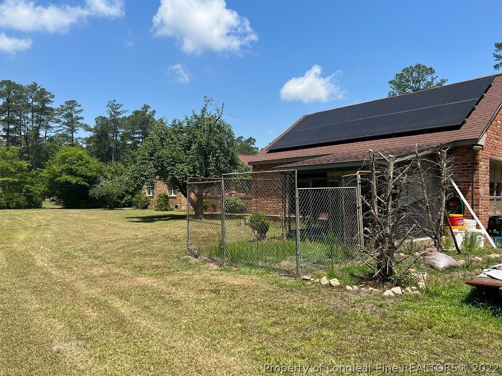 110 Bee Gee Road Lumberton, NC 28358 - Photo 3 of 42 a backyard of a house with table and chairs