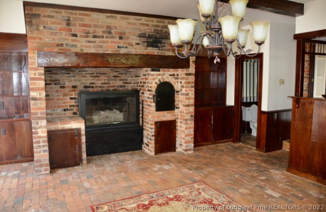 110 Bee Gee Road Lumberton, NC 28358 - Photo 35 of 42 a living room with furniture and a fireplace