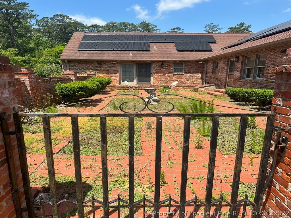110 Bee Gee Road Lumberton, NC 28358 - Photo 7 of 42 a front view of a house with garden and porch
