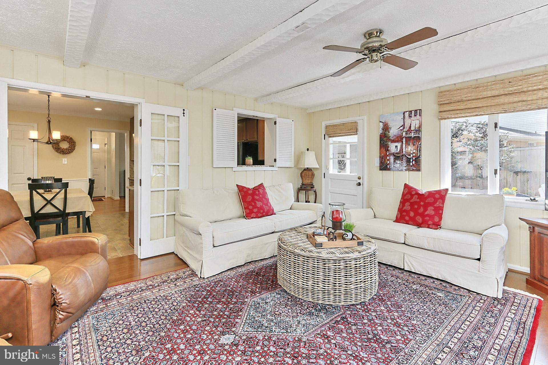 8920 Victoria Road Springfield, VA 22151 - Photo 16 of 49 Brick fireplace and ceiling fan