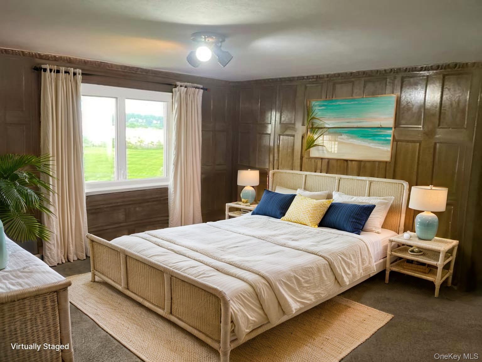 69 Cornwells Beach Road Sands Point, NY 11050 - Photo 19 of 42 a bedroom with a bed and wooden floor