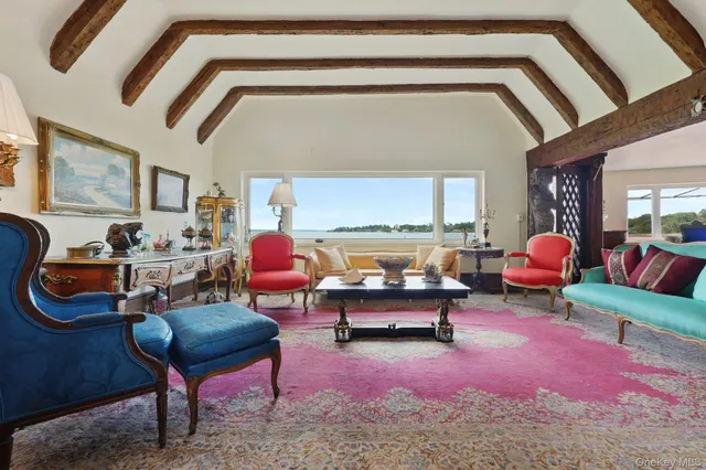a living room with furniture and a rug