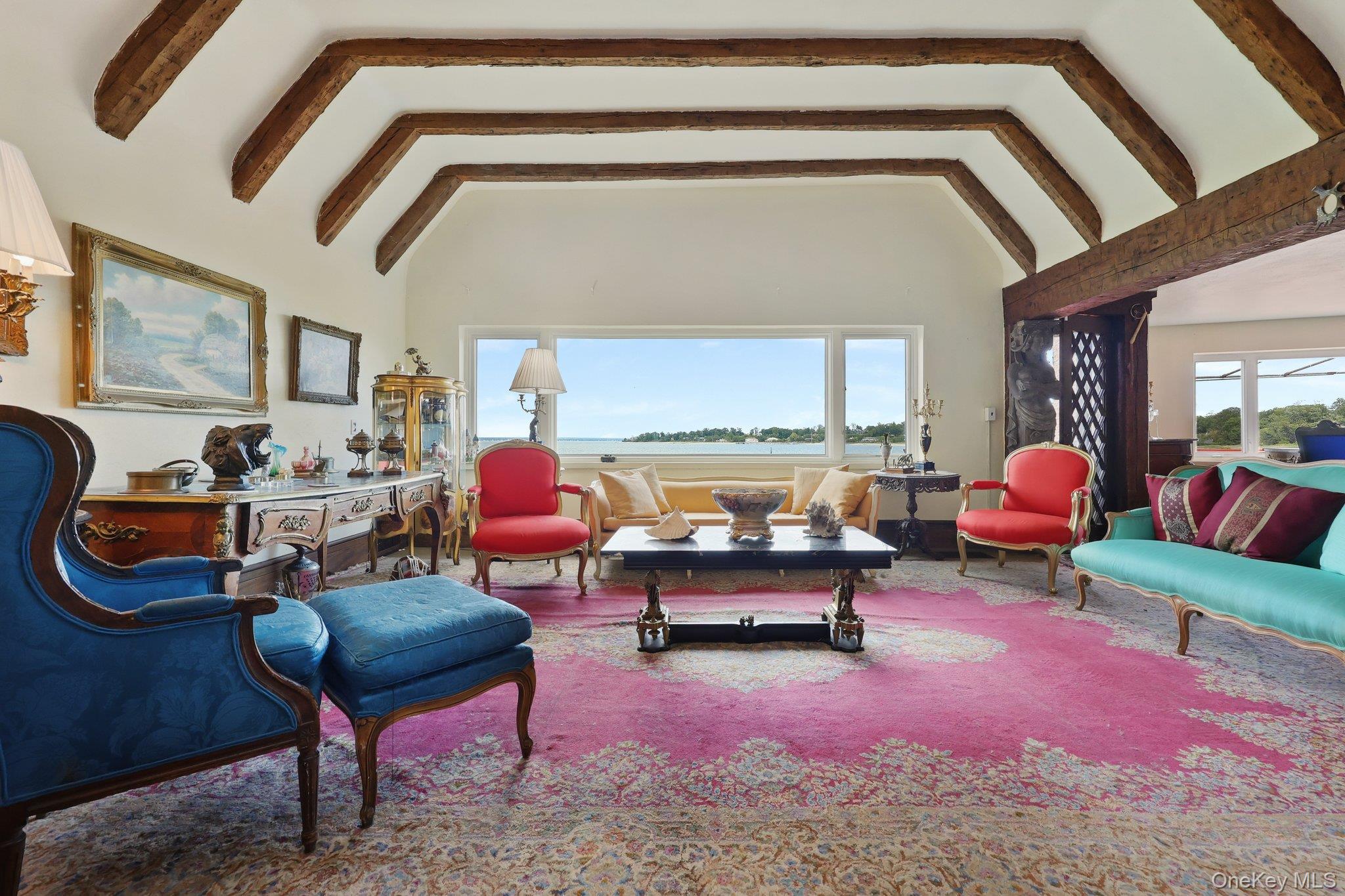 69 Cornwells Beach Road Sands Point, NY 11050 - Photo 2 of 42 a living room with furniture and a rug