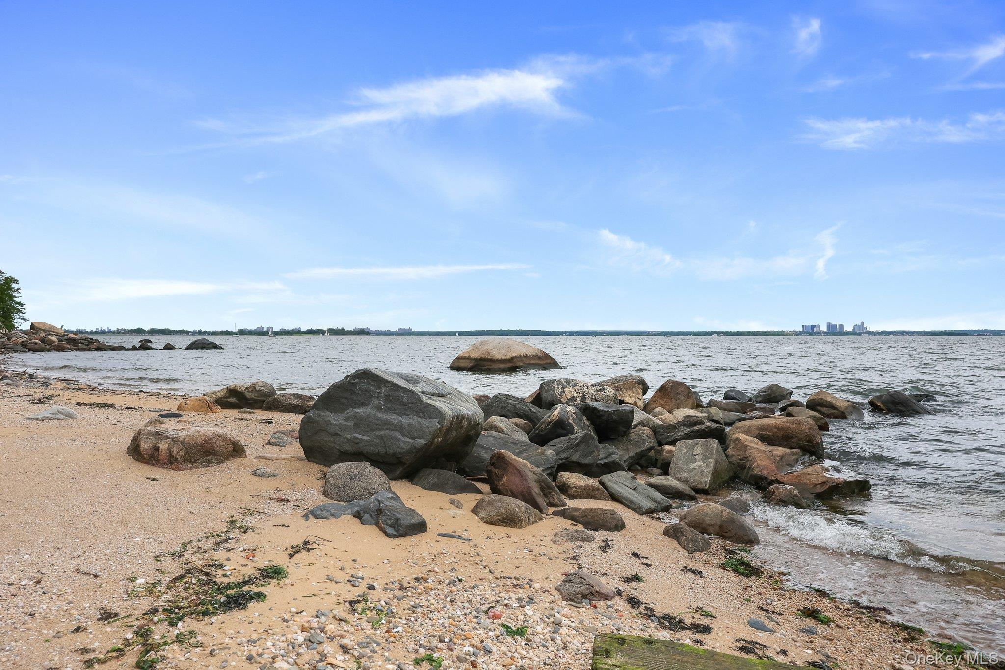 69 Cornwells Beach Road Sands Point, NY 11050 - Photo 24 of 42 a view of a ocean beach and mountain
