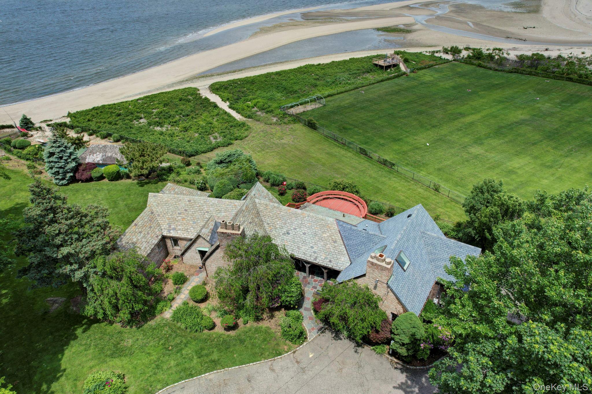 69 Cornwells Beach Road Sands Point, NY 11050 - Photo 26 of 42 an aerial view of a house