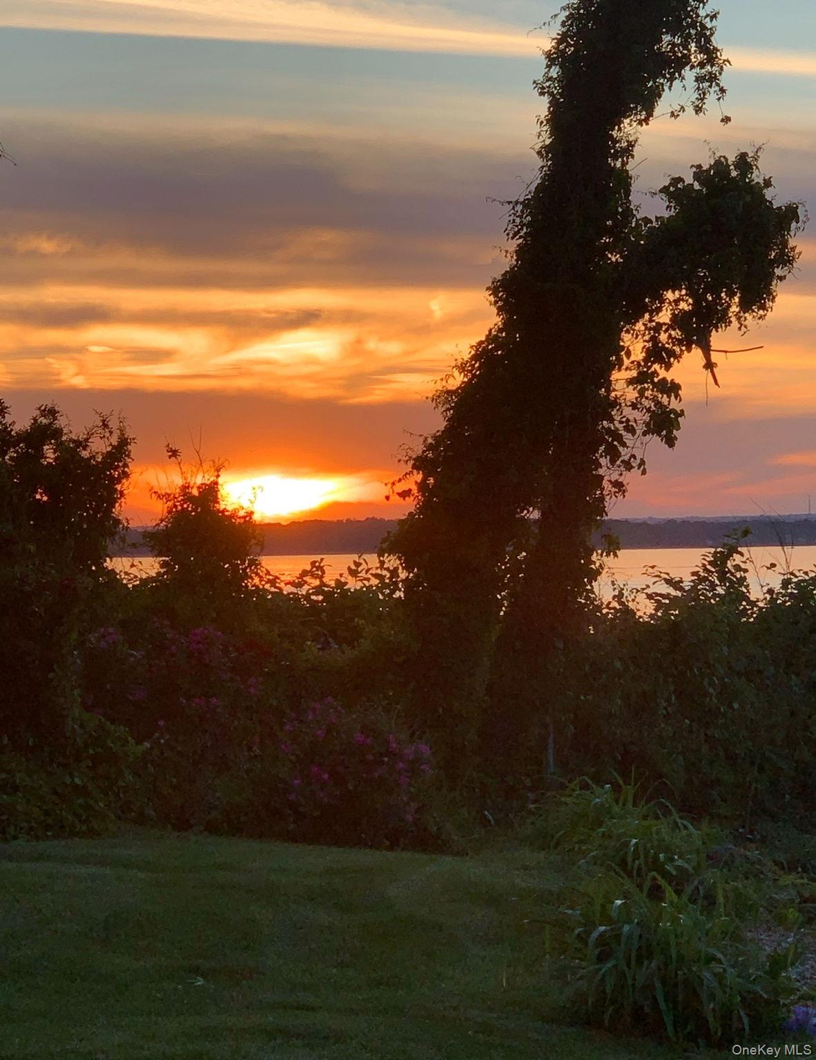 69 Cornwells Beach Road Sands Point, NY 11050 - Photo 32 of 42 a view of an ocean and a yard