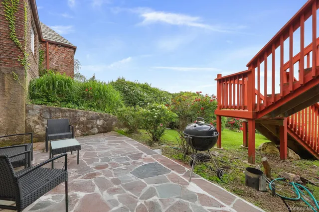 a view of house with yard and green space