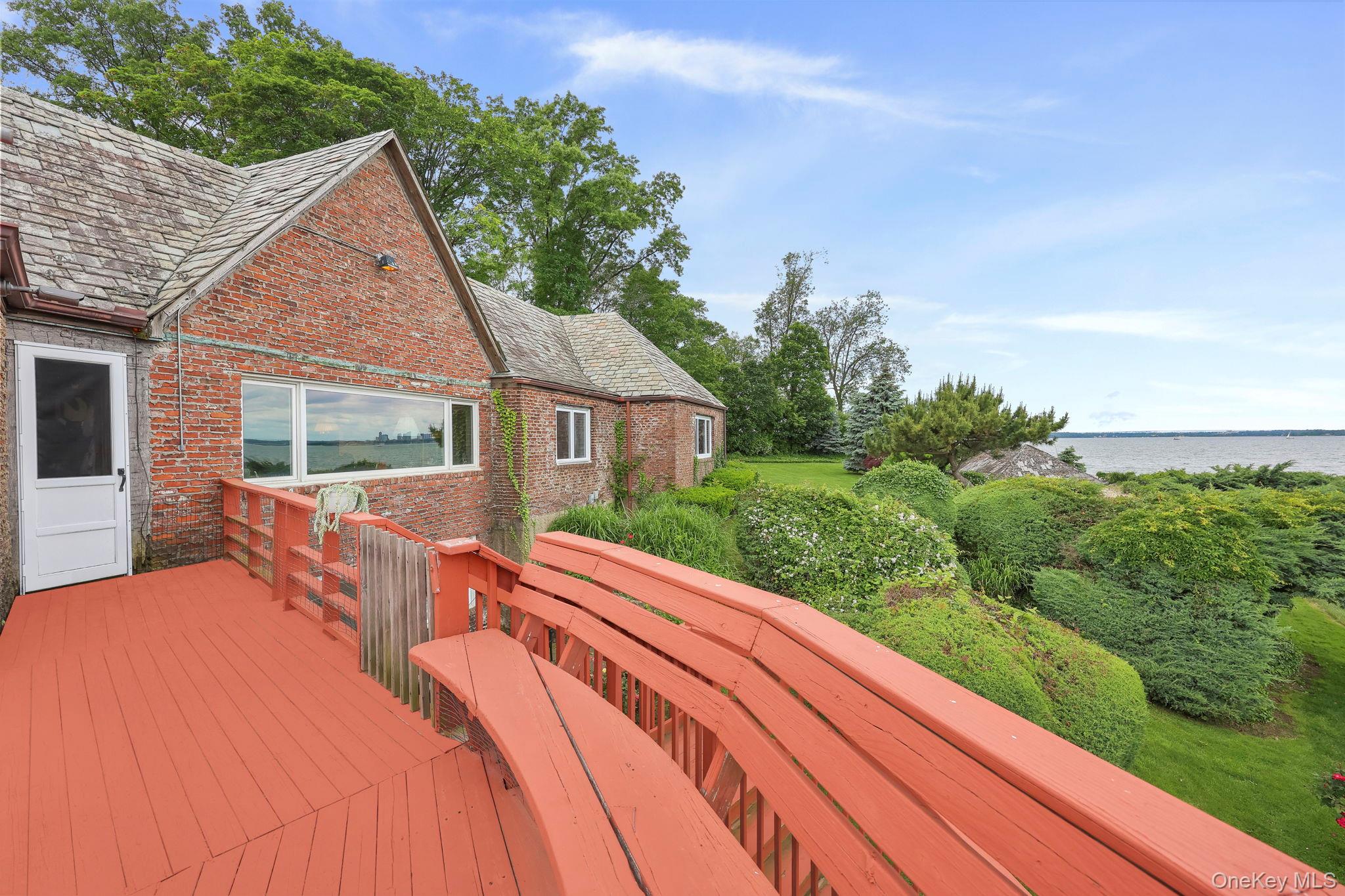 69 Cornwells Beach Road Sands Point, NY 11050 - Photo 34 of 42 a view of house with yard and green space