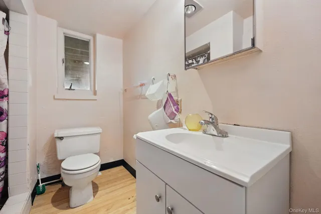 a bathroom with a sink a mirror and a shower