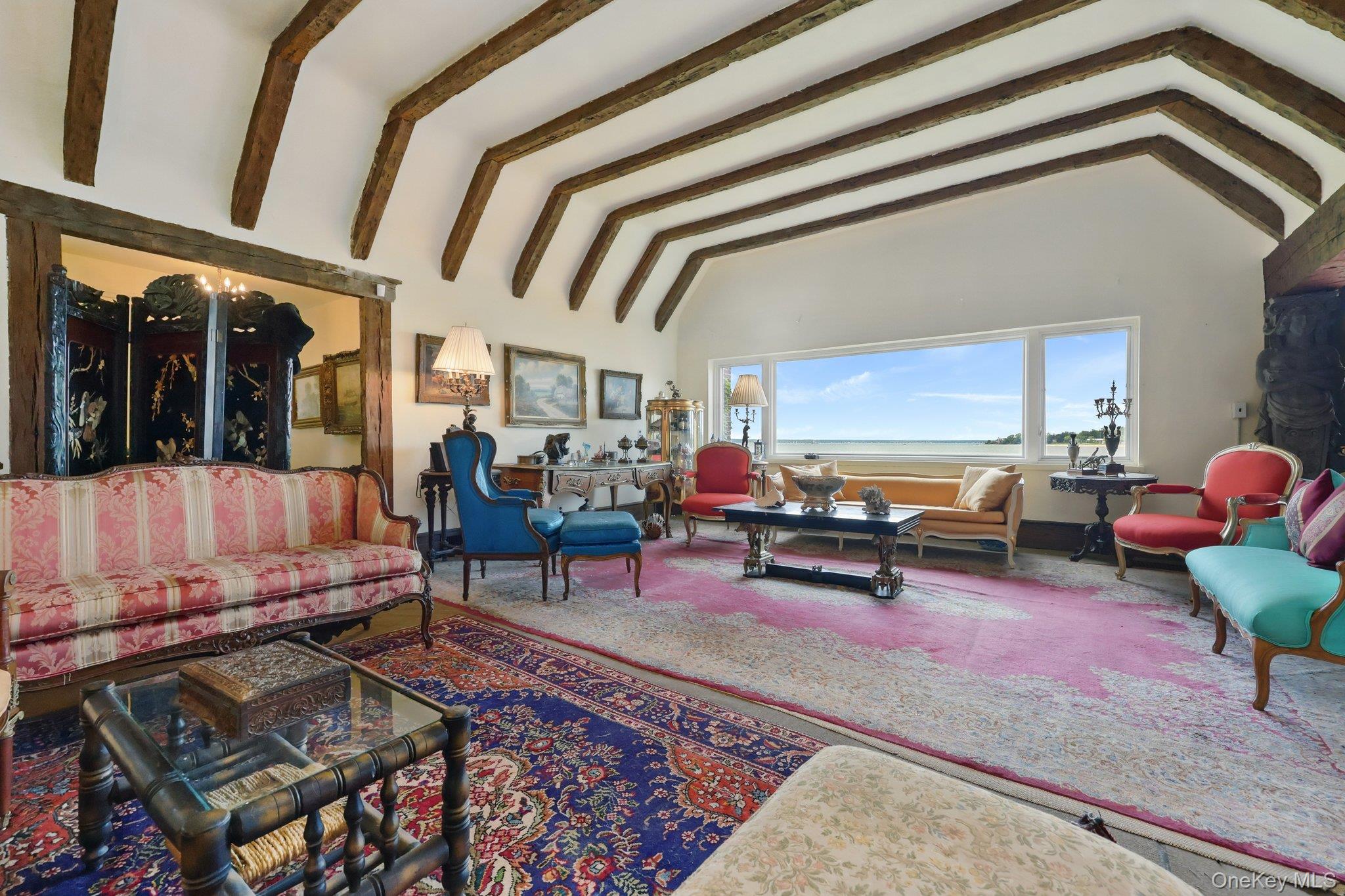 69 Cornwells Beach Road Sands Point, NY 11050 - Photo 40 of 42 a living room with furniture and a potted plant