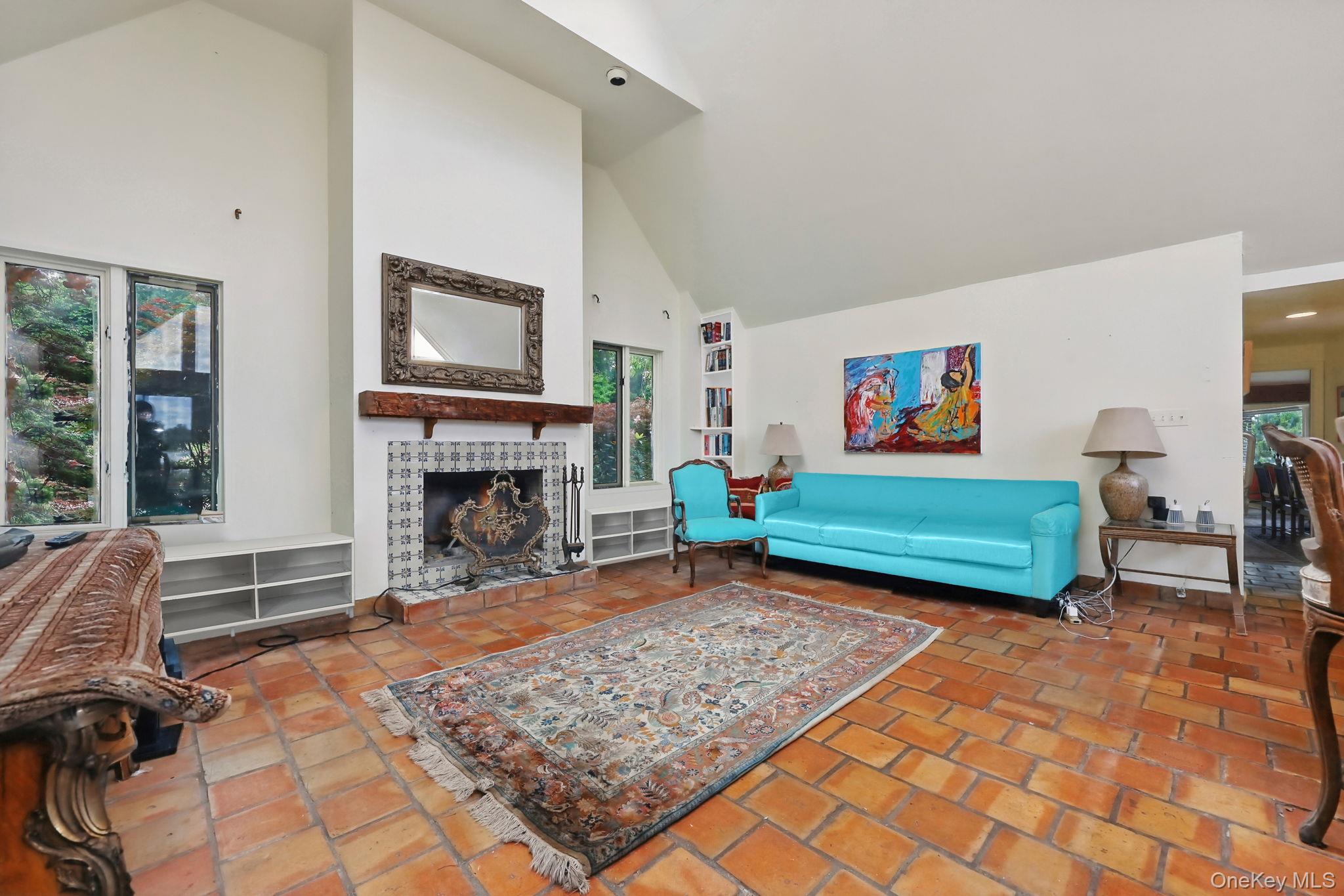 69 Cornwells Beach Road Sands Point, NY 11050 - Photo 4 of 42 a living room with furniture a rug and a fireplace