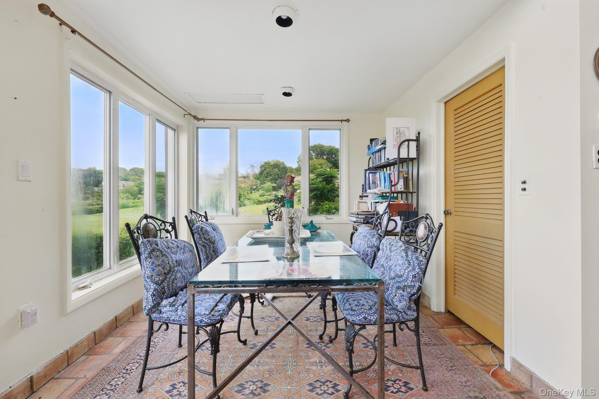 69 Cornwells Beach Road Sands Point, NY 11050 - Photo 8 of 42 a view of a dining room with furniture window and outside view