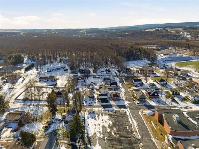 an aerial view of residential building with parking space