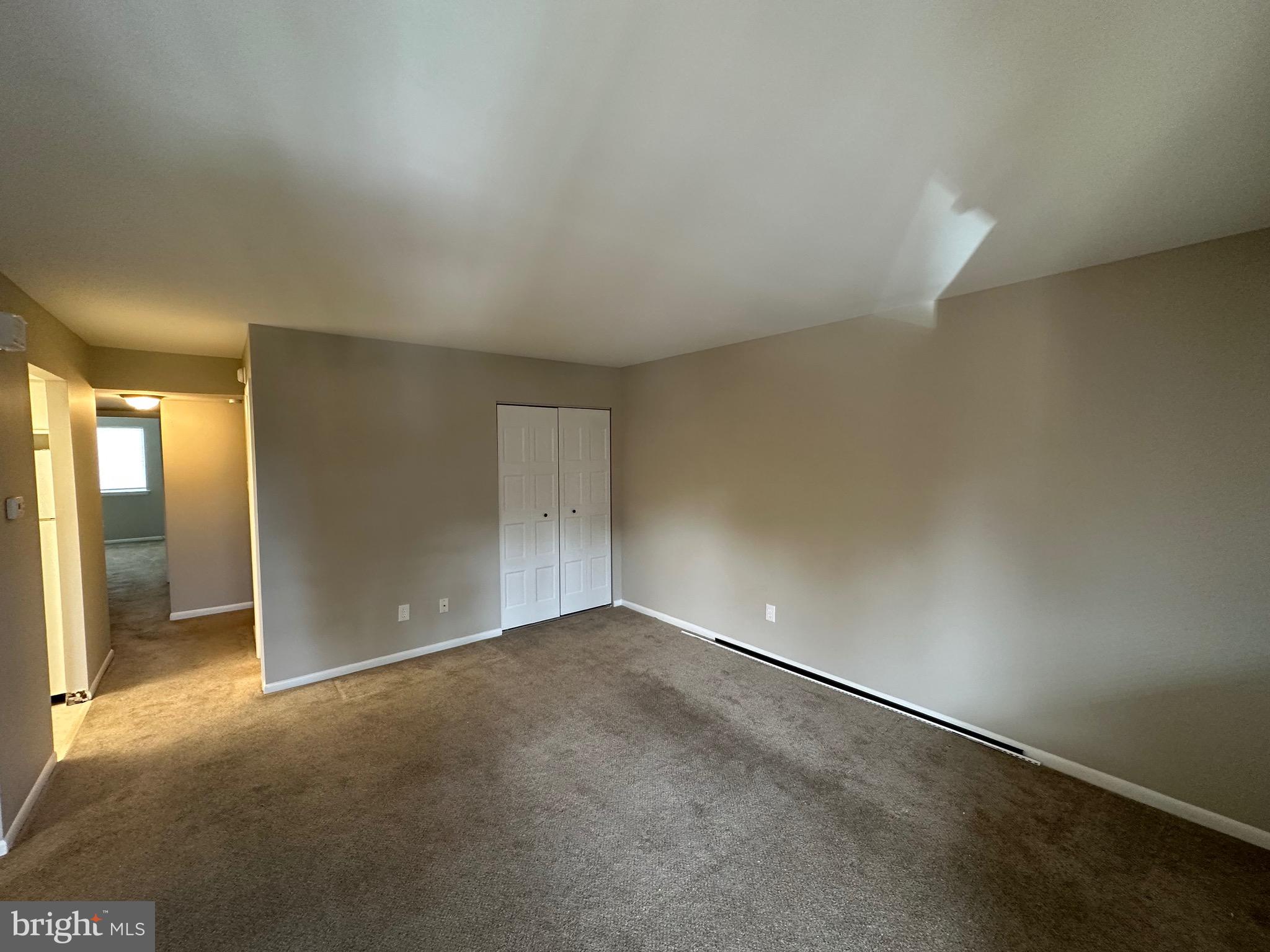 18204-00 Delaire Landing Road, Unit 204 Philadelphia, PA 19114 - Photo 2 of 14 an empty room with closet and windows
