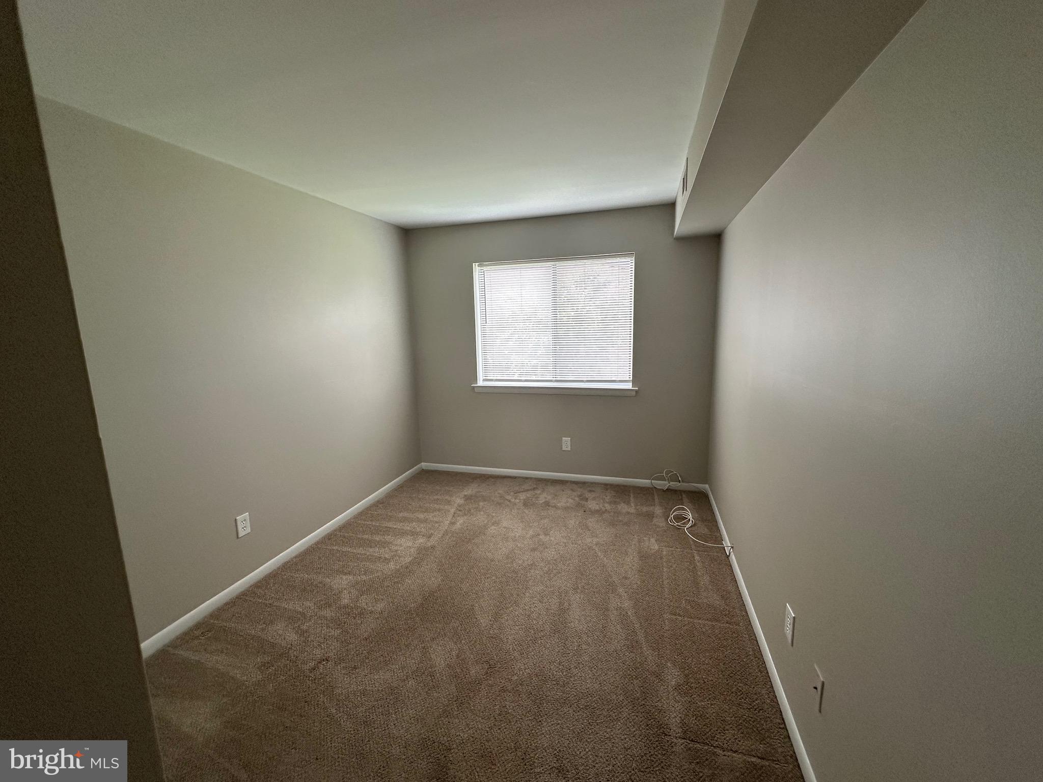 18204-00 Delaire Landing Road, Unit 204 Philadelphia, PA 19114 - Photo 4 of 14 an empty room with a window