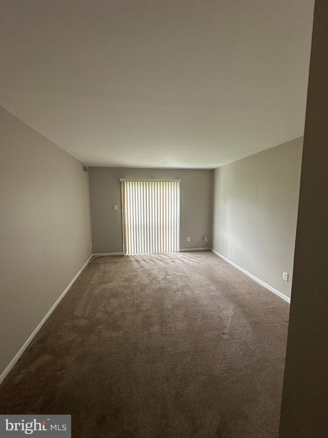 18204-00 Delaire Landing Road, Unit 204 Philadelphia, PA 19114 - Photo 5 of 14 a view of an empty room with a window