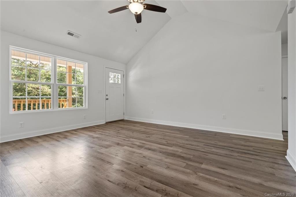 2993 Greenleaf Road, Unit 4 Clover, SC 29710 - Photo 8 of 45 wooden floor in an empty room with a window