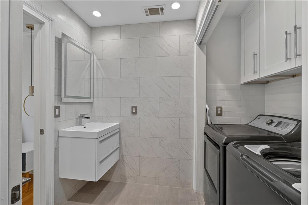 4610 West Morton Road Alpharetta, GA 30022 - Photo 24 of 53 a utility room with cabinets