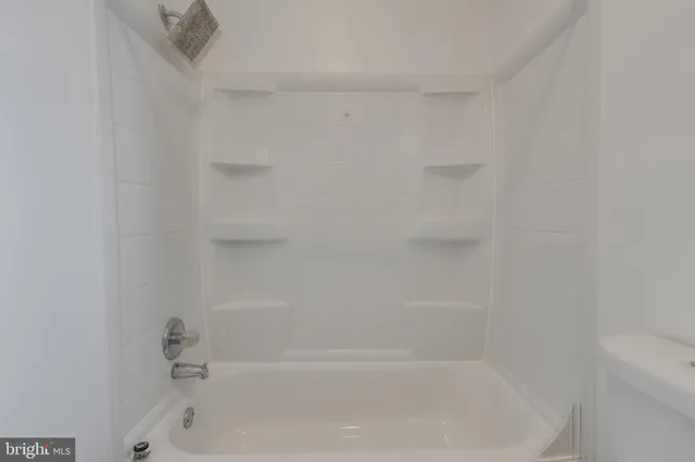 a close up of a bathtub curtain