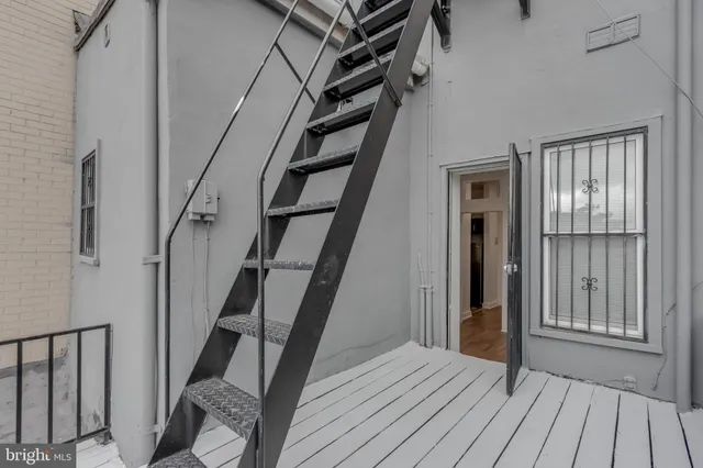 wooden floor to ceiling window and stairs