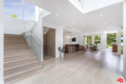 a view of a living room and entryway